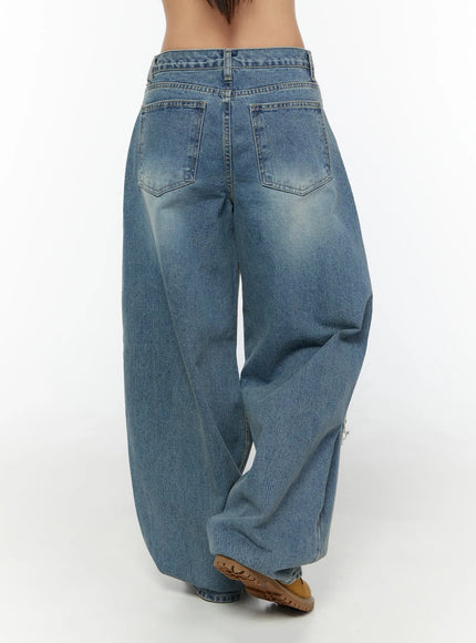 Mackenzie Blue Rip Jeans CU526 Blue back shot on model displaying dual back pockets, faded wash, and voluminous wide-leg hem