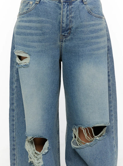 Mackenzie Blue Rip Jeans CU526 Blue close-up detail shot highlighting multiple frayed rip cutouts at thigh and knee with washed denim texture