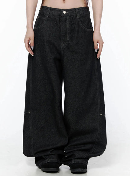 LEWKIN Maelani Rivet Wide Balloon Jeans IL502 Black front view on model showing extreme wide-leg balloon silhouette with contrast stitching and rivet detail, size S