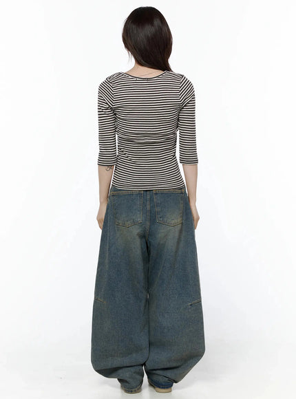 Marion Washed Wide-Leg Jeans IL506 Dark blue back view on model full-body showing wide balloon leg silhouette, back patch pockets with yellow stitching, pooled hem