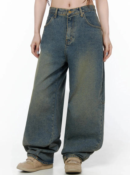 Marion Washed Wide-Leg Jeans IL506 Dark blue front cropped on model showing wide leg with vintage golden-green wash fade, front pockets, brass hardware, and beige sneakers