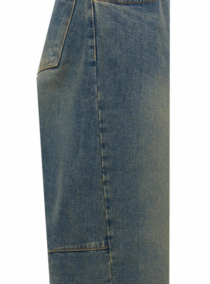 Marion Washed Wide-Leg Jeans IL506 Dark blue close-up detail of outer side seam and carpenter knee panel seam with golden-green wash fade on heavy denim fabric