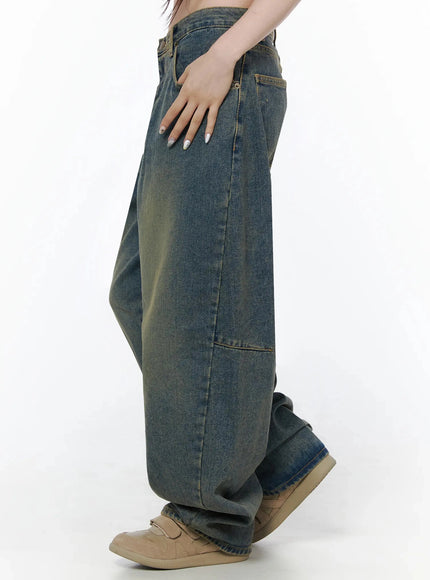 Marion Washed Wide-Leg Jeans IL506 Dark blue side profile on model showing outer leg seam, carpenter-style knee panel seam detail, and vintage yellow-tinted wash texture