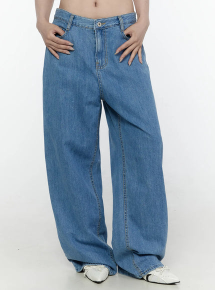 LEWKIN Max Wide Leg Jeans IL521 Blue front close-up on model showing low-rise waistband, button closure, and relaxed wide-leg denim silhouette, Size S