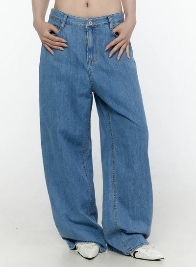 LEWKIN Max Wide Leg Jeans IL521 Blue front close-up on model showing low-rise waistband, button closure, and relaxed wide-leg denim silhouette, Size S