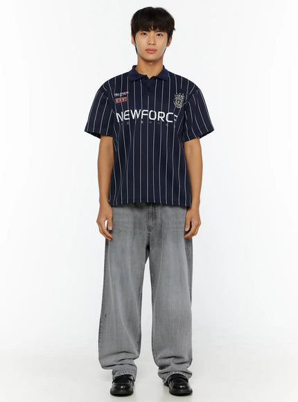 Men's Active Striped Polo Shirt IL509 dark blue front full-body model shot standing arms at sides showing NEWFORCE chest graphic white pinstripes and CYS-90 badge