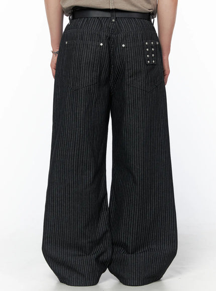 Men's Alexis Striped Wide Leg Jeans IU523 Black back view on model wearing leather belt with silver stud pocket detail and pinstripe denim
