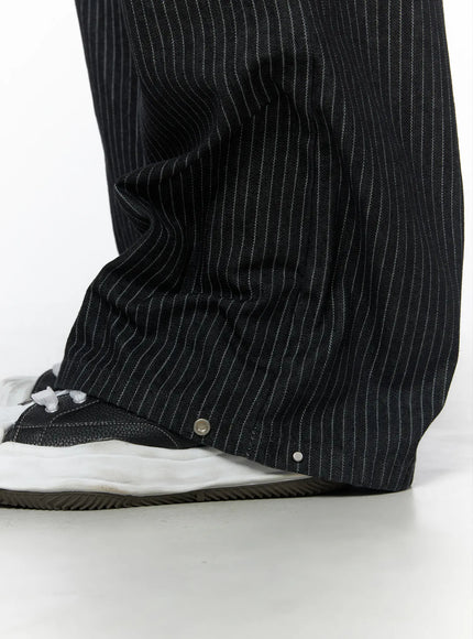 Men's Alexis Striped Wide Leg Jeans IU523 Black close-up detail of wide leg hem with silver snap button pooling over black and white sneaker