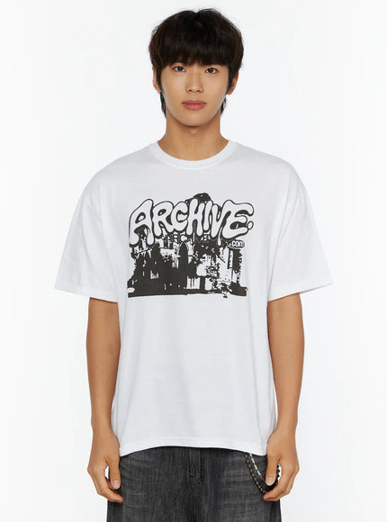 Men's Archive Graphic T-Shirt IL515 White close-up front crop view on model showing bold black ARCHIVE.com graffiti cityscape graphic on cotton tee
