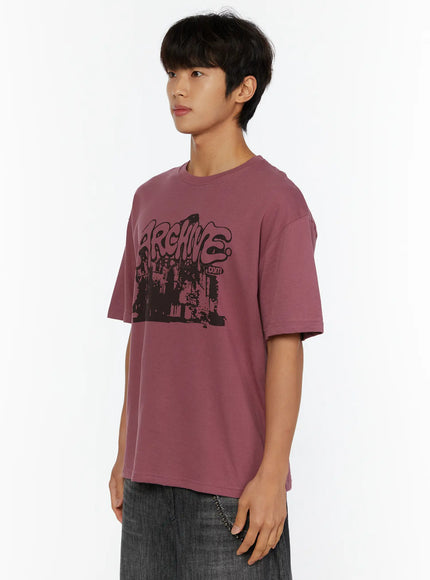 Men's Archive Graphic T-Shirt IL515 mauve side view on model looking left showing graffiti cityscape chest print and relaxed cotton silhouette