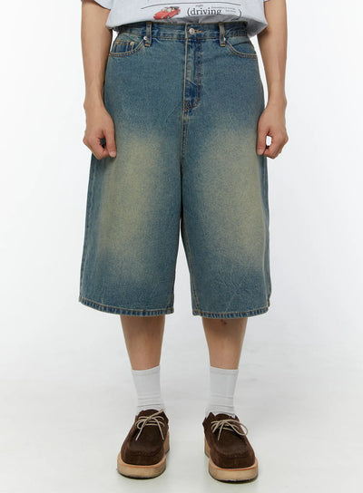 LEWKIN Men's Baggy Fit Jorts IU529 Blue front view on model wearing graphic tee and brown suede shoes, wide-leg washed denim shorts size M