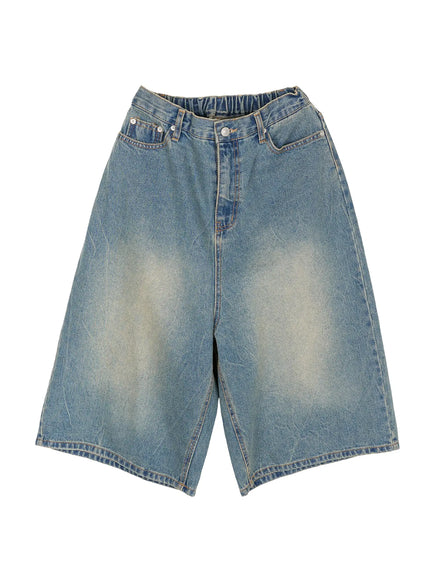 Men's Baggy Fit Jorts IU529 Blue flat-lay front view showing wide-leg silhouette, sun-faded wash, coin pocket, button fly, and elasticated waistband