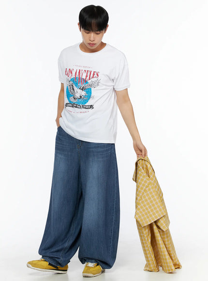 Men's Balloon Fit Linen Jeans (Blue) IL514 Blue full-body front shot on male model standing upright, styled with green striped henley tee and checkered slip-ons