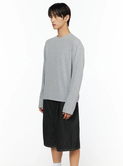 Men's Basic Long Sleeve T-Shirt IL528 Gray side shot on male model showing sleeve length and relaxed silhouette with black denim shorts