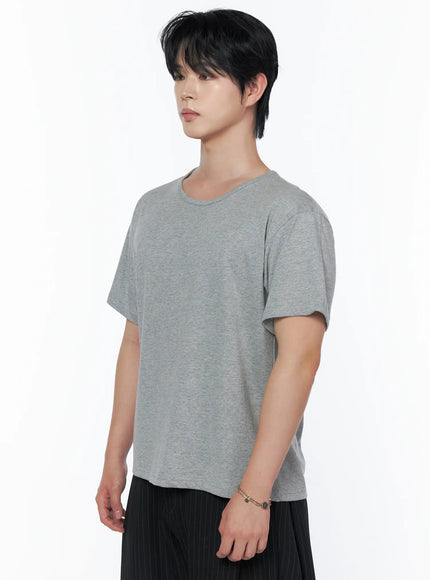 Men's Basic U-Neck T-Shirt IU523 Gray side shot on male model showing relaxed U-neckline boxy fit and melange cotton texture with bracelet detail