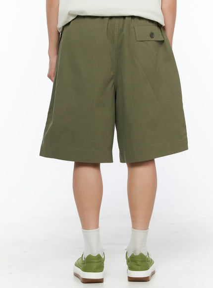 Men's Bermuda Shorts (Dark Green) IL514 Dark green back view on model showing button flap back pocket and elastic waistband detail
