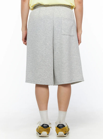 Men's Bermuda Sweat Shorts (Gray) IL514 Gray back view on model showing single back pocket, center seam and elastic waistband, heather fleece fabric