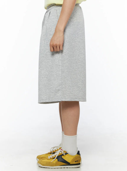Men's Bermuda Sweat Shorts (Gray) IL514 Gray side view close-up on model showing knee-length hem, heather texture and elastic waistband detail