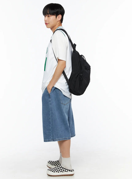 Men's Boston Sleeveless Jersey IL510 White side profile on male model carrying black backpack styled with denim shorts and checkered slip-on shoes
