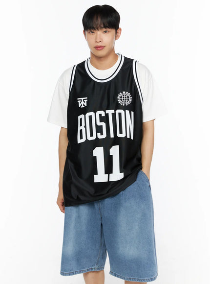 Men's Boston Sleeveless Jersey IL510 Black front view on male model standing with hand in pocket layered over white tee paired with denim shorts
