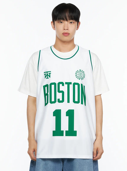 Men's Boston Sleeveless Jersey IL510 White close-up front shot on male model highlighting BOSTON 11 green lettering globe logo and neckline tipping
