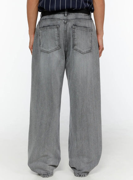 Men's Bryce Distressed Wide-Leg Jeans IL509 Light gray back close-up on model showing dual back pockets and wide-leg hem with raw edge finish