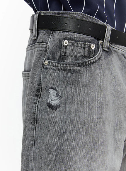 Men's Bryce Distressed Wide-Leg Jeans IL509 Light gray close-up detail shot of coin pocket, silver rivets, distressed hole, and washed denim texture