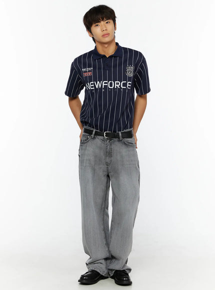 Men's Bryce Distressed Wide-Leg Jeans IL509 Light gray front full-length shot on male model styled with navy NEWFORCE pinstripe polo, hands behind back