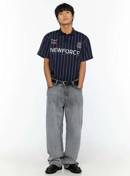 Men's Bryce Distressed Wide-Leg Jeans IL509 Light gray front full-length shot on male model styled with navy NEWFORCE pinstripe polo, hands in pockets
