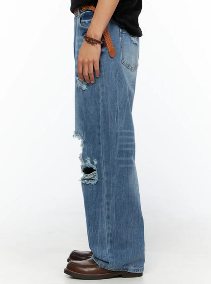 Men's Bryce Ripped Straight-Fit Jeans IL520 Blue side view on model showing knee rip detail wide leg silhouette braided belt back pocket brown loafers
