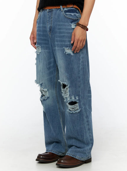 Men's Bryce Ripped Straight-Fit Jeans IL520 Blue side view close-up on model showing left-leg ripped details with braided leather belt and brown loafers