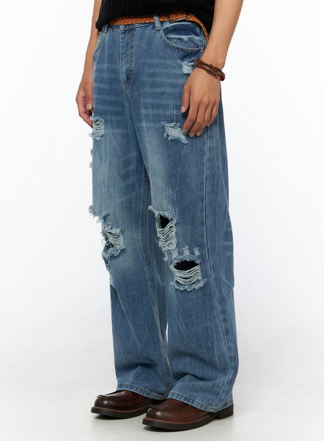 Men's Bryce Ripped Straight-Fit Jeans IL520 Blue side view close-up on model showing left-leg ripped details with braided leather belt and brown loafers