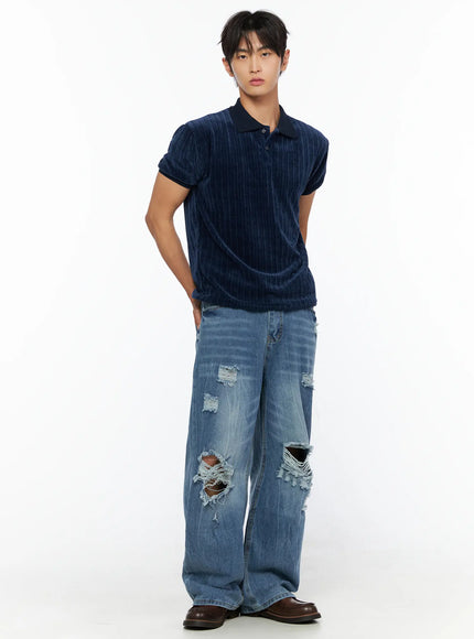 Men's Bryce Ripped Straight-Fit Jeans IL520 Blue full-body front shot on male model styled with navy velour polo shirt hands behind back brown loafers