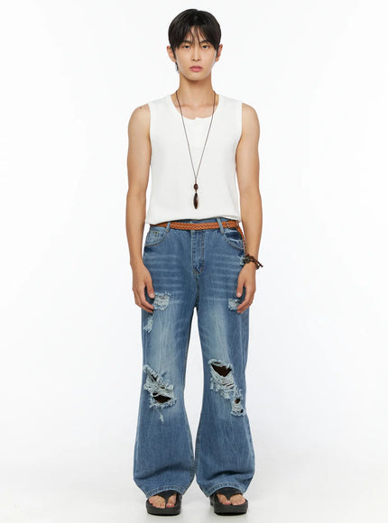 Men's Bryce Ripped Straight-Fit Jeans IL520 Blue full-body front shot on male model in white sleeveless tank top arms at sides braided belt sandals necklace