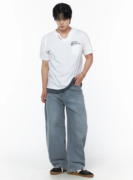 Men's Button Detail Logo T-Shirt IL502 White full-body front view on model with hand in pocket, split V-neck button detail and REPLAY-DNM chest graphic, styled with wide jeans