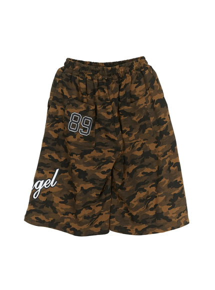 Men's Camo Graphic Shorts (Dark Green) IL509 flat-lay back view showing elastic waistband, 89 number patch on side pocket, Angel script partially visible, dark green camo pattern