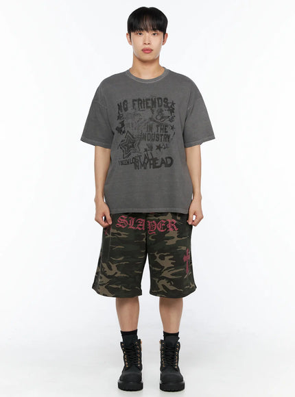 Men's Camo Graphic Sweat Shorts (Dark Green) IL514 Dark green full-body front view on model styled with charcoal washed graphic tee and black boots