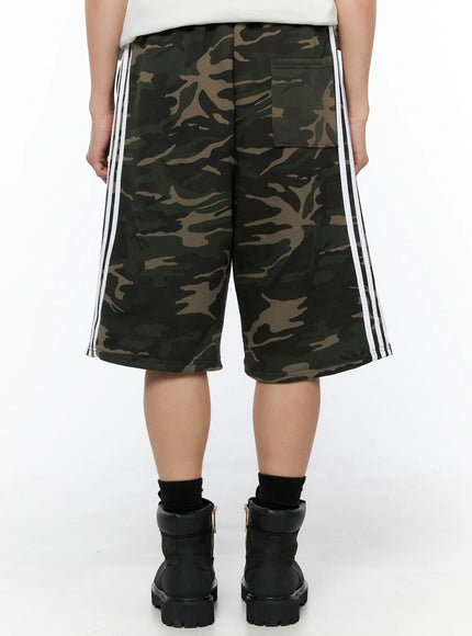 Men's Camo Graphic Sweat Shorts (Dark Green) IL514 Dark green back view on model showing white triple side stripes utility back pocket and wide hem