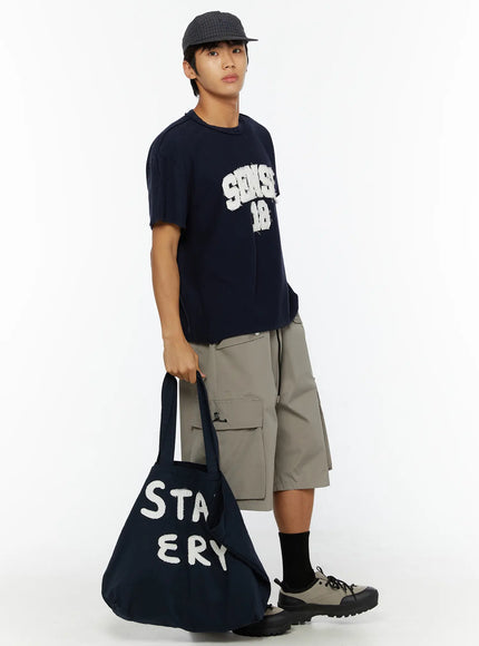 Men's Cargo Bermuda Shorts (Gray) IL509 Gray full-body side shot on male model styled with navy graphic tee, cap, and tote bag