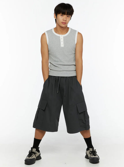 Men's Cargo Jorts IL510 Dark gray full front view on male model standing wide-legged with hands in pockets drawstring waist cargo pockets