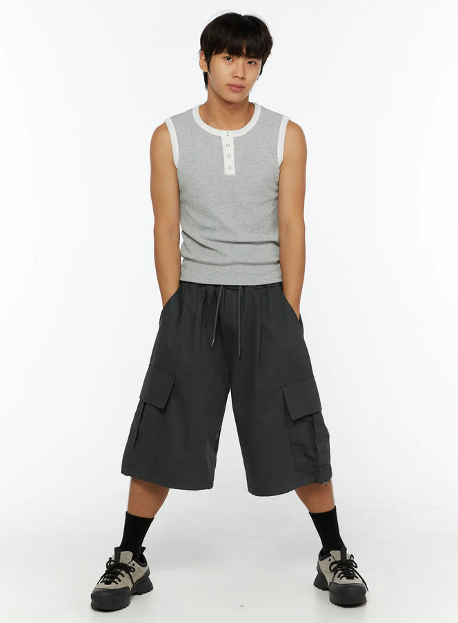 Men's Cargo Jorts IL510 Dark gray full front view on male model standing wide-legged with hands in pockets drawstring waist cargo pockets