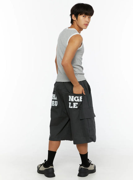 Men's Cargo Jorts IL510 Dark gray flat-lay front showing elastic drawstring waistband dual front cargo flap pockets wide-leg cut drawstring hem