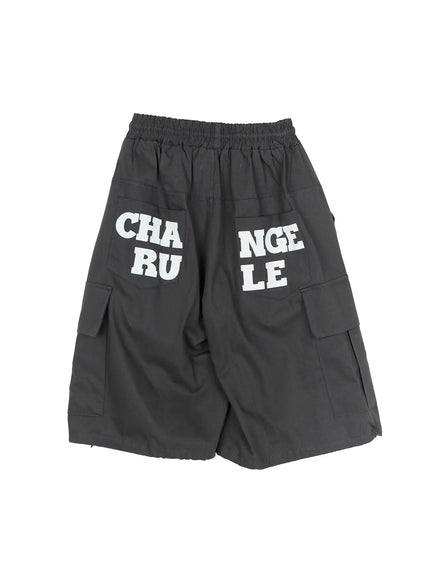 Men's Cargo Jorts IL510 Dark gray flat-lay back angled view displaying CHANGE RULE split white letter print on back pockets with cargo pockets on sides