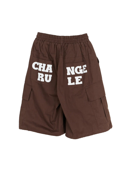 Men's Cargo Pocket Jorts IL510 Dark brown flat-lay back view showing white CHANGE RULE graphic print across rear back pockets elastic waistband and side cargo pockets