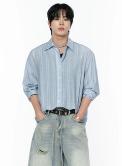 LEWKIN Men's Casual Button-Up Shirt IL502 Light blue front view on model size M/L with tonal stripe texture, worn open over black tank with distressed jeans