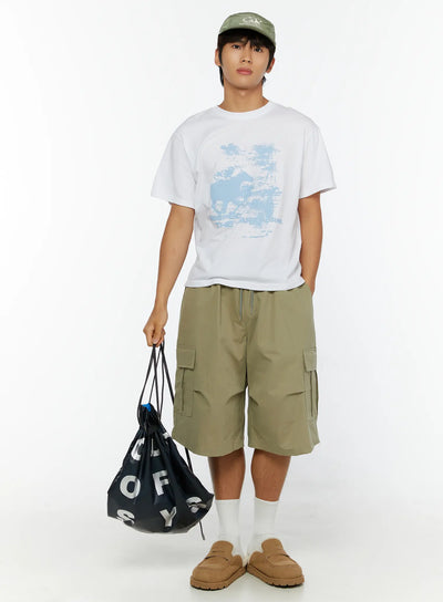 LEWKIN Men's Casual Graphic Print T-Shirt IL513 White full-length front shot on male model styled with olive cargo shorts, green cap, and black drawstring bag