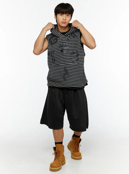 Men's Casual Jorts IL510 Black full-body front shot on male model with striped sleeveless hoodie hands raised casual street style pose