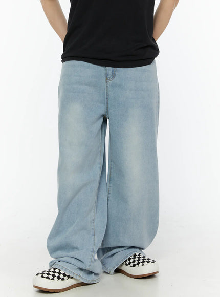 Men's Casual Relaxed Fit Jeans IL509 Ice blue front view on male model standing in full-body shot, paired with black crewneck tee and checkered sneakers, wide-leg fit