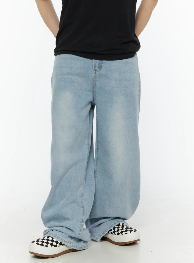 Men's Casual Relaxed Fit Jeans IL509 Ice blue front view on male model standing in full-body shot, paired with black crewneck tee and checkered sneakers, wide-leg fit
