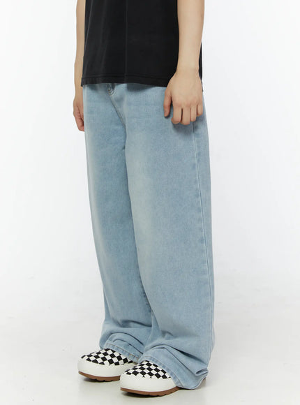 Men's Casual Relaxed Fit Jeans IL509 Ice blue side view on model revealing ultra-wide leg profile, side seam detail, faded ice blue denim with checkered shoes